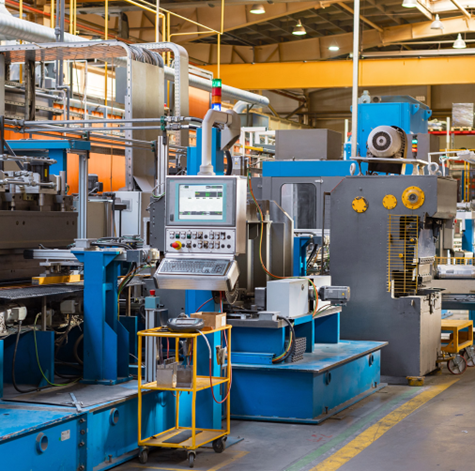 Emergency automation repair technician diagnosing industrial equipment
